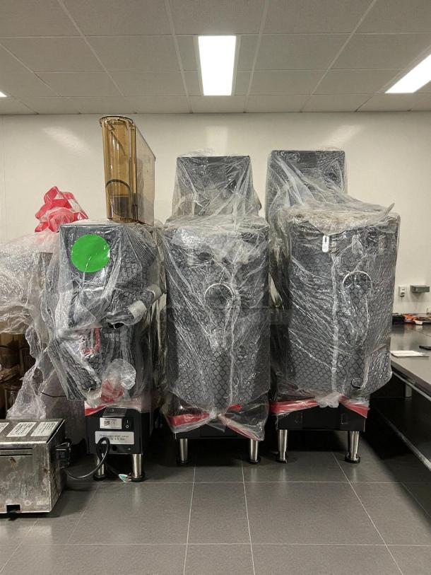 Clover Vertica Coffee Maker and Boiler Tower, like new, wrapped in protective plastic, 220v, 3-phase wiring visible.