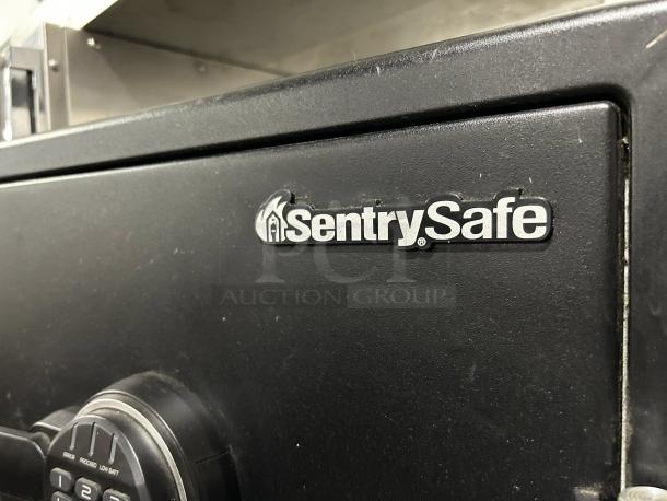 Sentry Safe Fire-Safe, 1.23 cu ft, digital keypad access, logo visible. Great condition, tested and working.