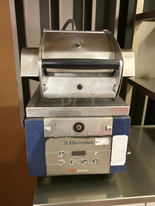 Electrolux HSPPME infrared panini grill, excellent condition, tested and working. Features control panel and Electrolux logo.