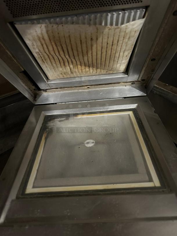 Electrolux HSPPME infrared panini grill in excellent condition, showing interior grilling surface and heating elements.