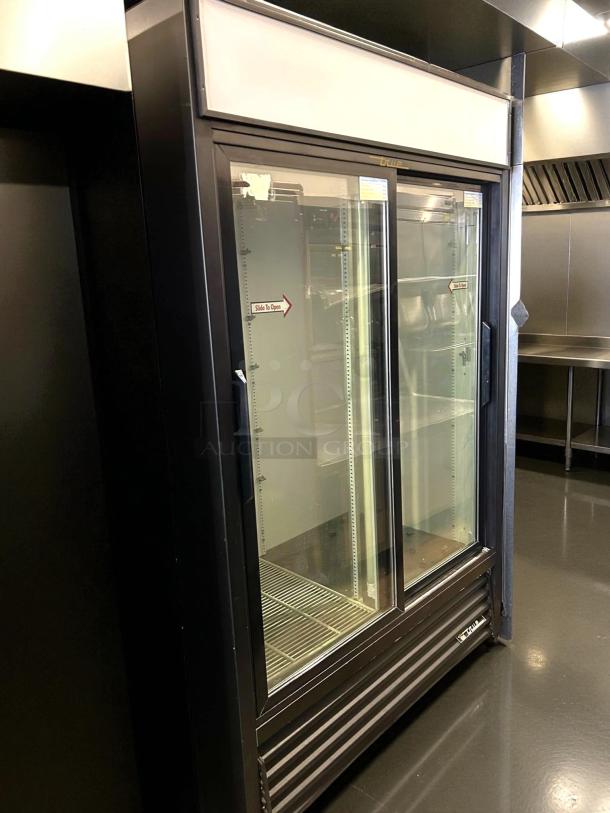 True GDM-45-HC-LD merchandiser, 51 1/8", black, two sliding glass doors, excellent condition, 115v, tested and working.