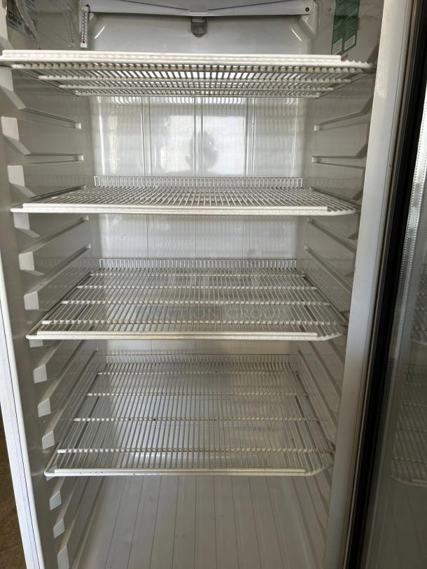 Turbo Air TGM-22RV-N6 glass door merchandiser, excellent condition, four adjustable shelves, right hinge door, white interior.