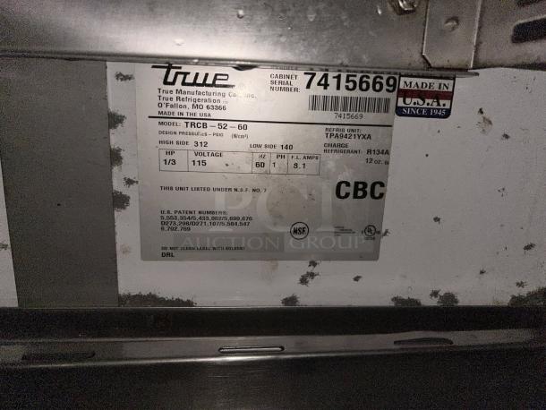 True TRCB-52-60-HC Refrigerated Chef Base label showing specifications, model, refrigerant type, and voltage details.