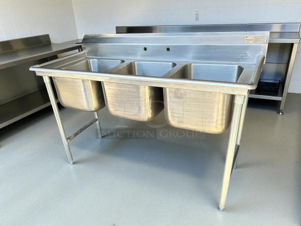 Advance Tabco T9-3-54-X 3 compartment stainless sink in excellent condition, featuring 18-gauge 16"x20" bowls.