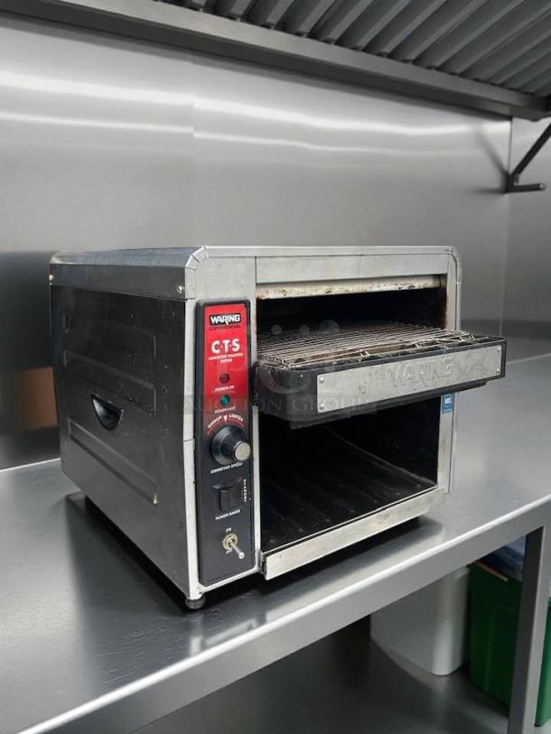 Waring CTS1000 conveyor toaster, 450 slices/hr, 2" opening, tested and working, featuring control panel and branding.