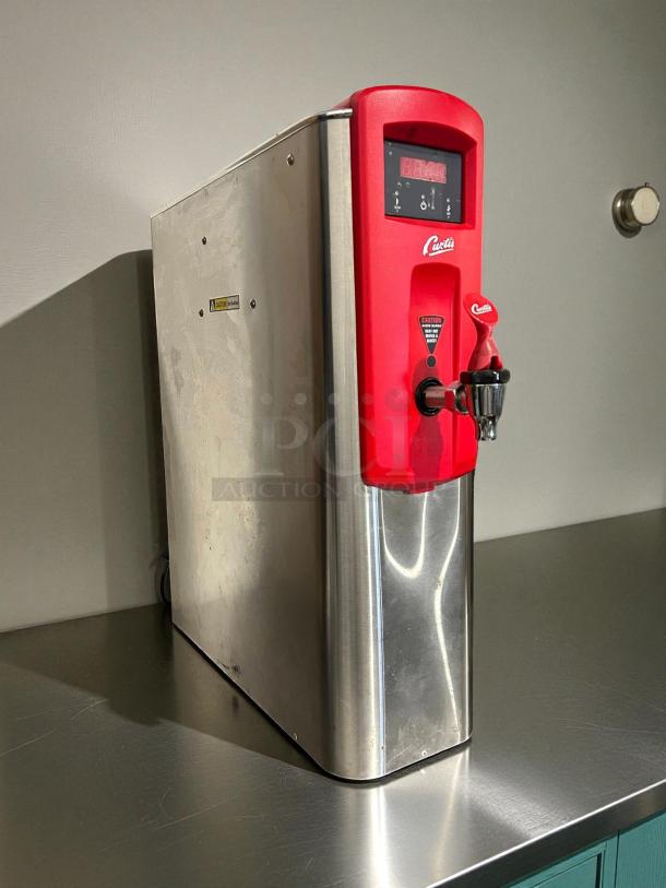 Curtis WB5N G3 5-Gal Hot Water Dispenser, red and stainless steel, excellent condition, 120/220V, tested and working.