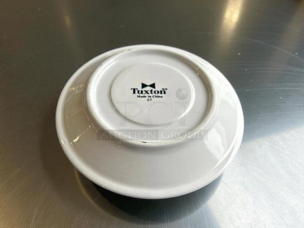 Tuxton No. 07 6” white dinner plate, like new, with "Tuxton Made in China 07" label underneath.