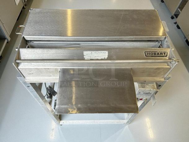 Hobart W32-6 hand wrap station, 3 roll film capacity, 120v, stainless steel, tested and working, visible Hobart branding.