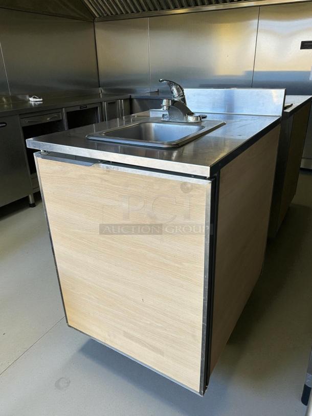 Duke UB-PS-24-CM stainless steel hand sink cabinet, 24" wide, great condition, tested and working, features a faucet.