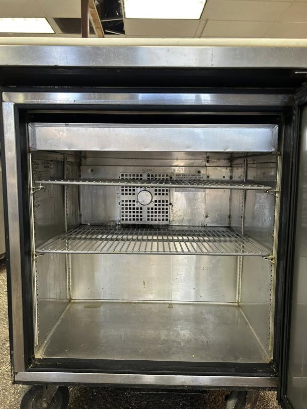 True TSSU-27-08-HC refrigerated sandwich prep table, excellent condition, right hinged door, interior shelves, tested and working.
