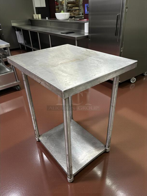 Eagle Group stainless steel worktop table, excellent condition, featuring sturdy lower shelf and polished surface.