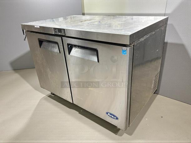 Alt text: Atosa MGF8402GR 48" double door undercounter refrigerator in excellent condition, stainless steel finish, tested and working.
