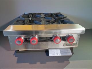 Brand new Therma-Tek TCHP24-4 countertop gas hotplate with 4 burners, stainless steel, original packaging visible.