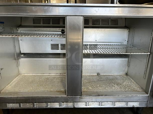 Beverage-Air UCR48 undercounter refrigerator, 115V. Dual shelves, prime condition, fully tested. Model tag visible on interior.