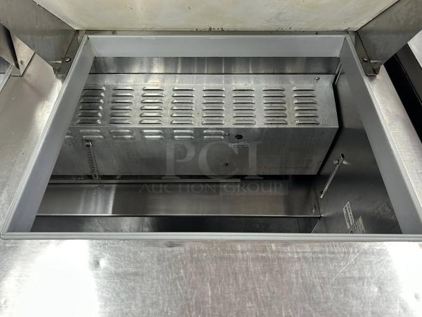 Continental Refrigeration sandwich prep table, dual lid, stainless steel, prime condition, interior view, fully tested.