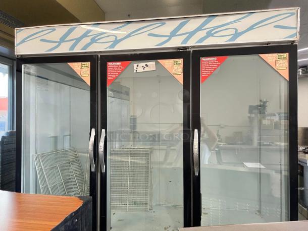 Beverage-Air CRG74-1, 3-door glass refrigerator, excellent condition, fully tested, self-contained, 115V, visible warning labels.