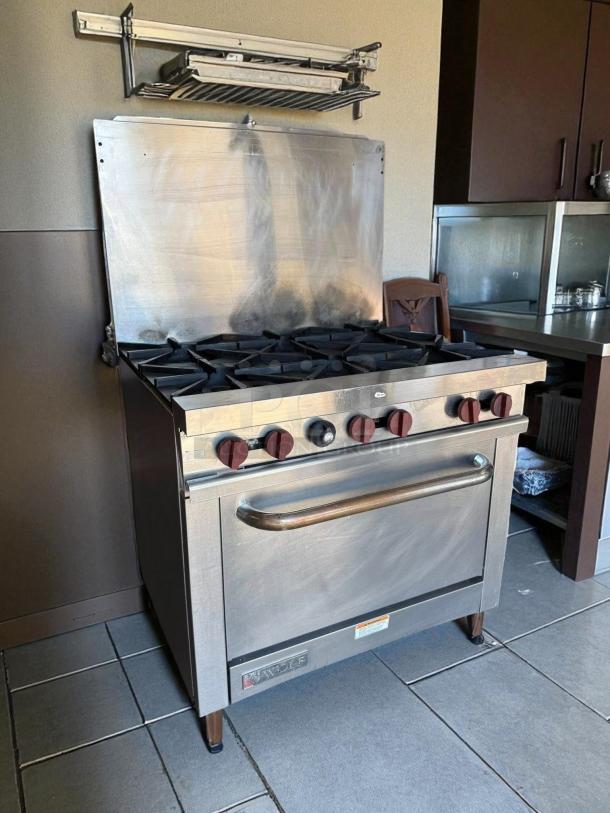 Wolf 36" 6-burner gas restaurant range, prime condition, natural gas, with standard oven, fully tested and working.