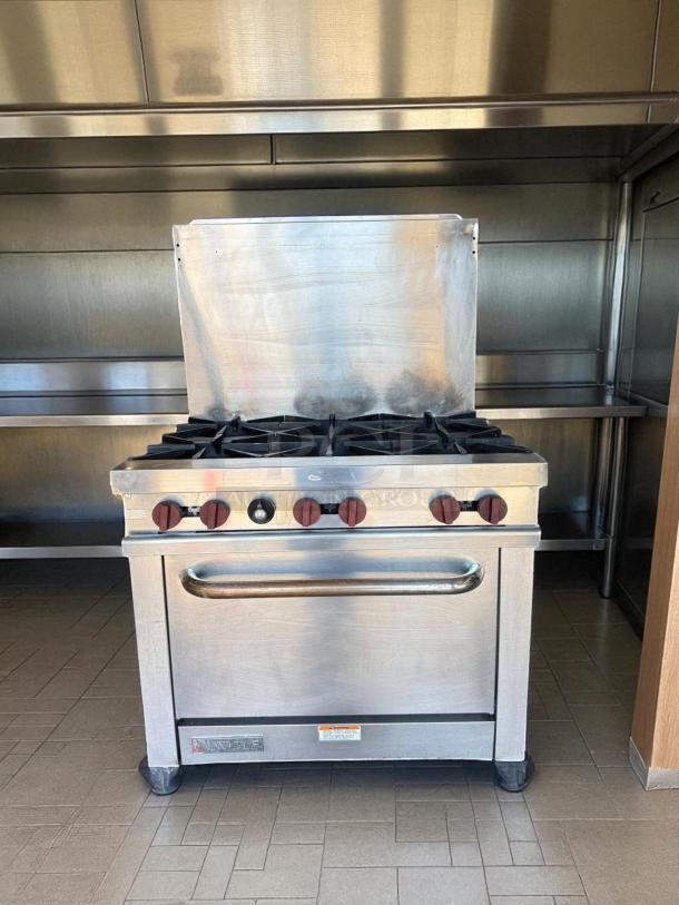 Wolf 36" 6-Burner Gas Restaurant Range with Standard Oven, natural gas, prime condition, tested and fully working.