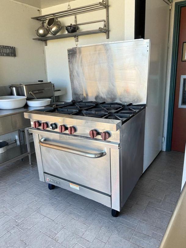 Wolf 36" 6-burner gas restaurant range with standard oven in prime condition, fully tested, natural gas.