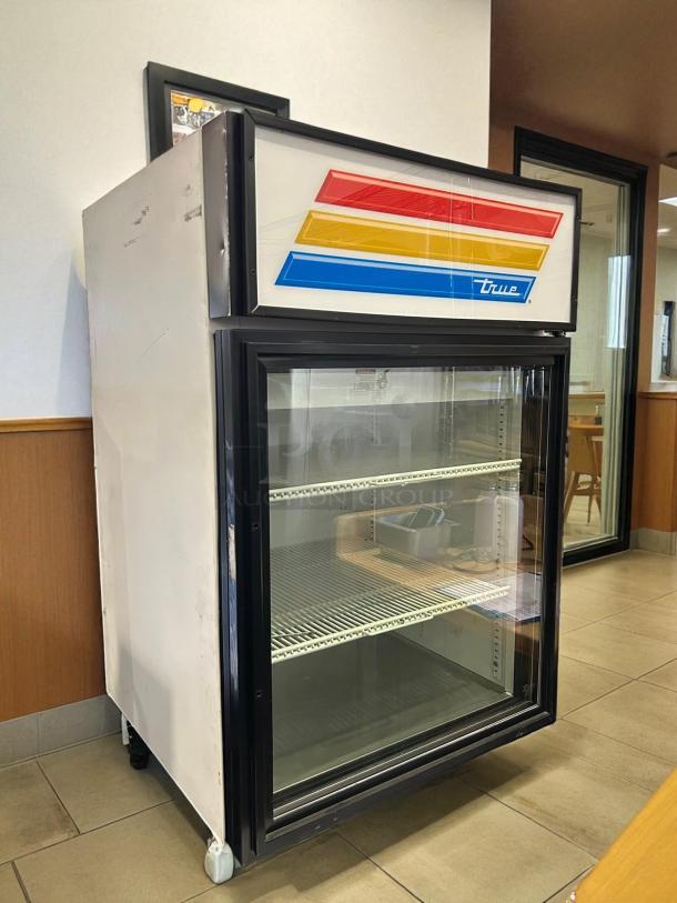 True GDM-05-LD glass door refrigerator, superb condition, 115V, tested and working. White exterior, vibrant logo, single door.