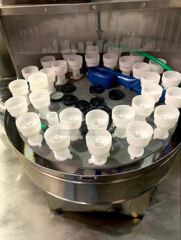 Tang Machinery Automated Bottle Washing Unit in superb condition, part of 9-piece production line, shown rinsing components.