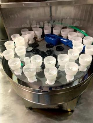 Tang Machinery Automated Bottle Washing Unit in superb condition, part of 9-piece production line, shown rinsing components.