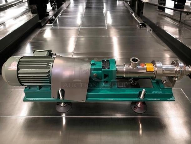Tang screw feeding pump, superb condition, part of 9-piece production line, tested working, industrial use, stainless steel.