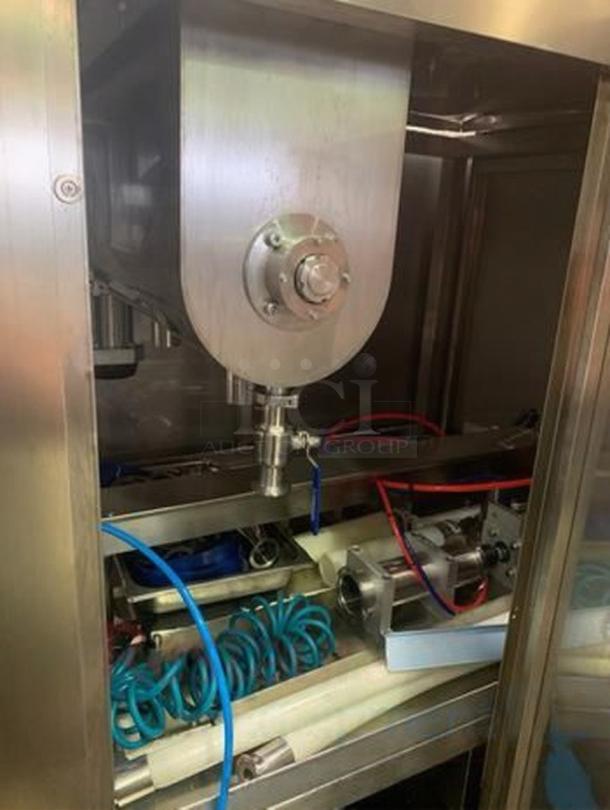 Tang Machinery Dual-Nozzle Automatic Filling System in superb condition, designed for precision sauce and liquid volume filling.