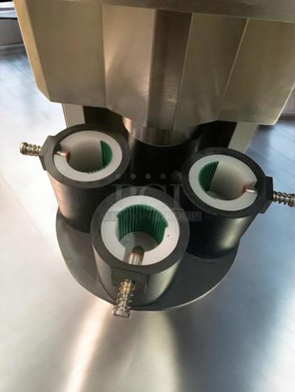 Tang Machinery semi-automatic four-station vacuum capping machine, superb condition, fully tested, ideal for secure vacuum-seal bottle capping.