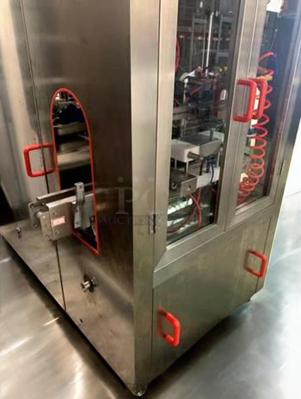 Tang Machinery semi-automatic four-station vacuum capping machine in superb condition, fully tested, with red handles.