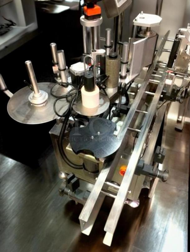 Tang Machinery TGM-TY01 automatic bottle labeling machine, superb condition, high-speed 360° wrap-around, fully tested.