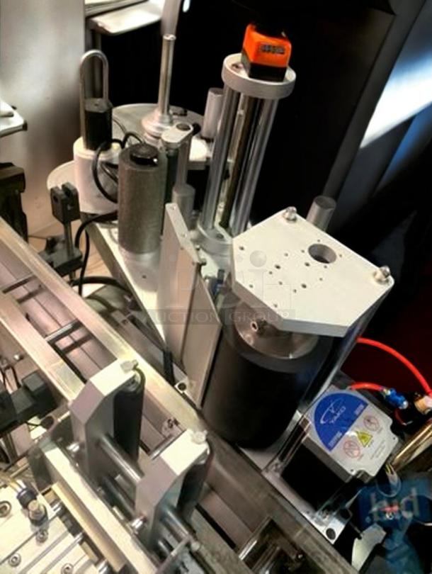 Tang Machinery TGM-TY01 automatic round bottle labeling machine in superb condition, high-speed 360° wrap labeling.