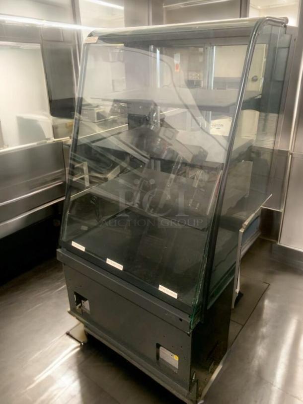 Refrigerated bakery/deli display case in superb condition, full glass front, multi-shelf, tested and working, ideal for merchandising.