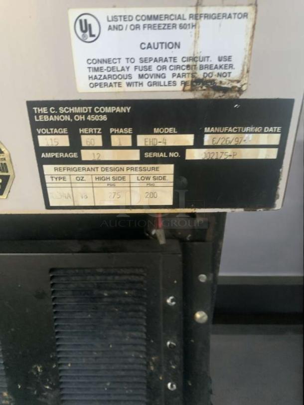 EHD-4 refrigerated display case by C. Schmidt Company. Labels show model, 115V, 60Hz, tested working. Serial 302175-P.
