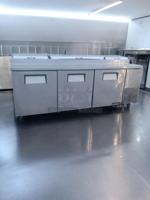 Prime Condition True TPP-93 refrigerated pizza prep table, 93", stainless steel, on casters, fully tested, 115V.