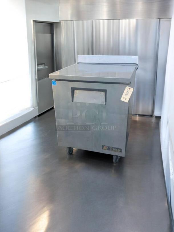 True TWT-27F one-door worktop freezer in prime condition. Features stainless steel exterior, casters, and visible model tag. Fully tested.