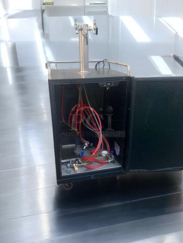 Kegco K309X-2 kegerator, dual faucet, pristine condition. Open door showing interior setup with hoses and connectors.