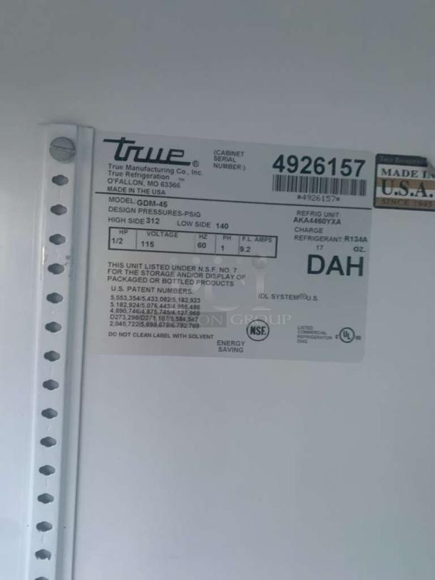 Label of True GDM-45 2-Door Glass Merchandiser Refrigerator, showing model info, voltage (115V), and NSF certification.