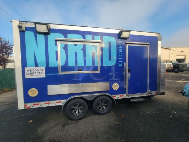 2021 16' Quality mobile food trailer for ghost kitchens, featuring blue exterior, service window, and commercial kitchen setup.