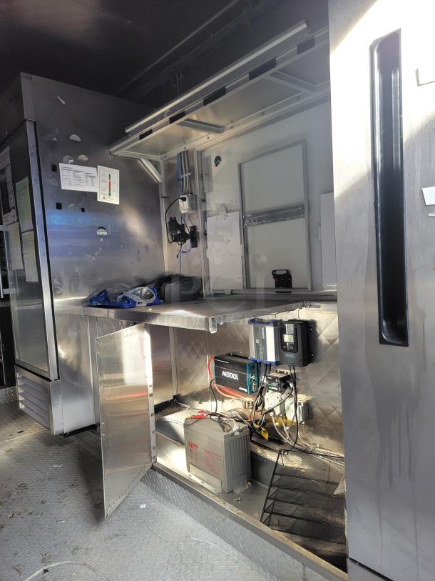 2021 Quality 16' Mobile Commercial Ghost Kitchen interior. Features stainless steel surfaces, electrical setup, and Arctic Air unit.