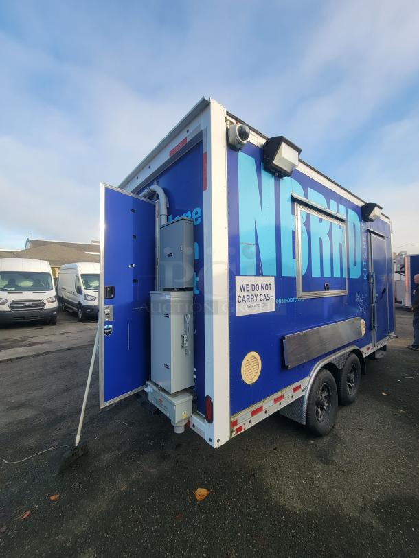 2021 16' Quality tandem-axle mobile food trailer, blue exterior with NBRHD branding, service window, exterior electrical panels.