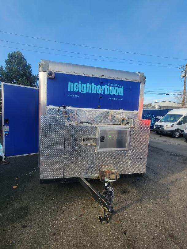 2021 Quality 16' Mobile Commercial Ghost Kitchen trailer with Neighborhood Kitchens branding, stainless steel exterior.