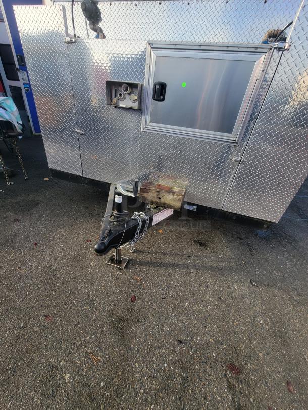 2021 16' Quality Mobile Commercial Ghost Kitchen, diamond-plated exterior with service window and towing hitch visible.