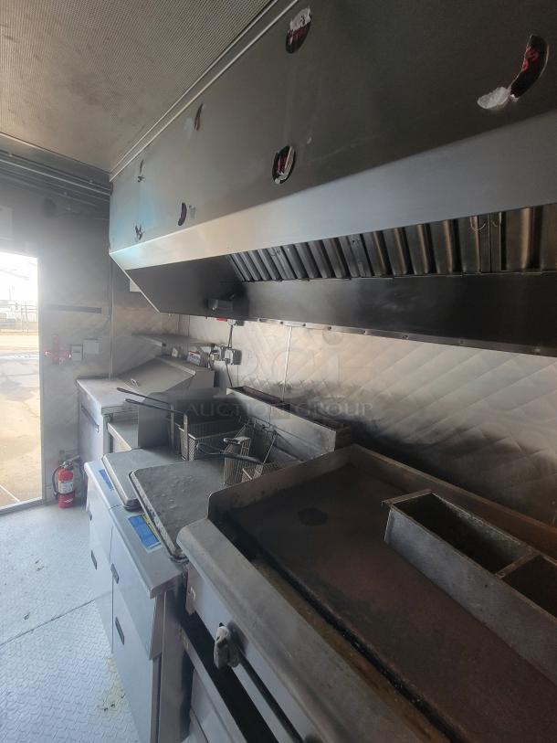 2021 16' Quality mobile food trailer with stainless steel interior, commercial range hood, flat-top griddle, and deep fryer.