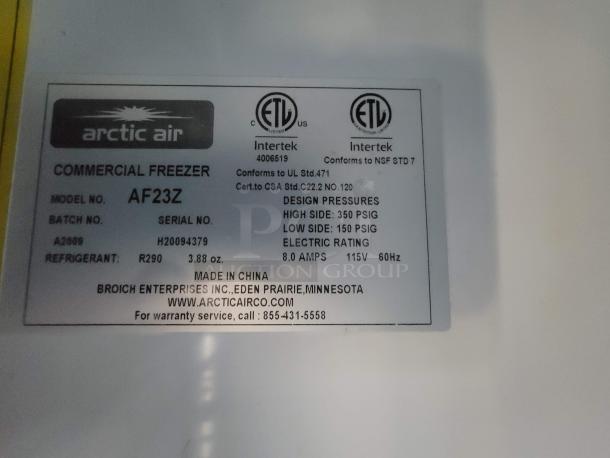 Label on Arctic Air commercial freezer model AF23Z, R290 refrigerant, 115V, 8.0 amps, certifies NSF STD 7 compliance.