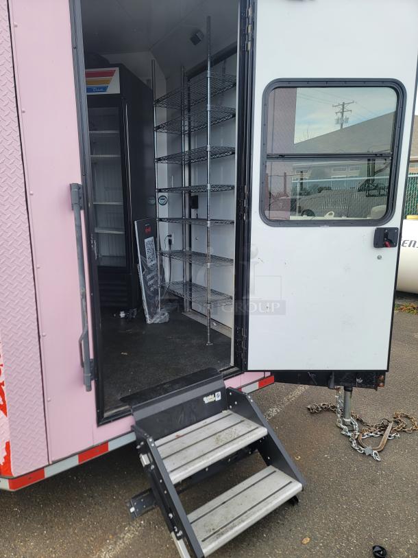 2021 SDG 'Goodees' retail/food trailer, pink/red wrap, interior includes True Refrigeration units, chrome shelving, pink door, step system.