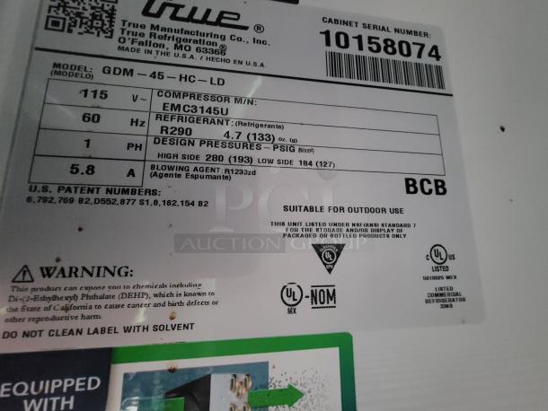 Label detailing model GDM-45-HC-LD Refrigerator by True, showing voltage, refrigerant type R290, and safety warnings.