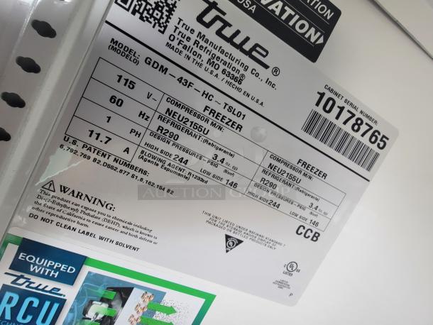 Label close-up of True GDM-43F-HC-TSL01 Freezer, showing 115V, R290 refrigerant, 11.7A, with safety and warning details.