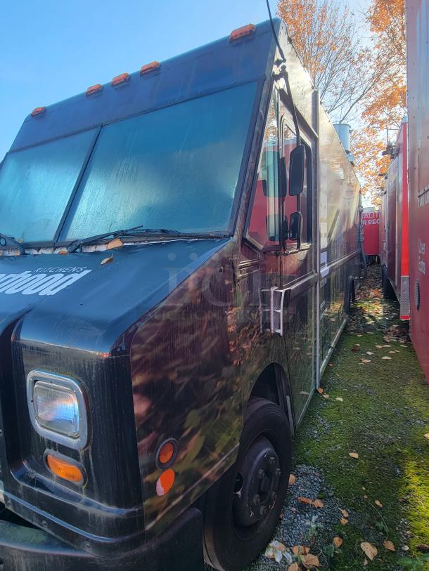 2004 Freightliner MT45 Step-Van mobile kitchen with stainless steel interior, commercial cookline, and refrigeration systems.