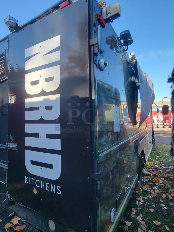 2004 Freightliner MT45 Step-Van mobile kitchen, black exterior with "NBRHD KITCHENS" branding.